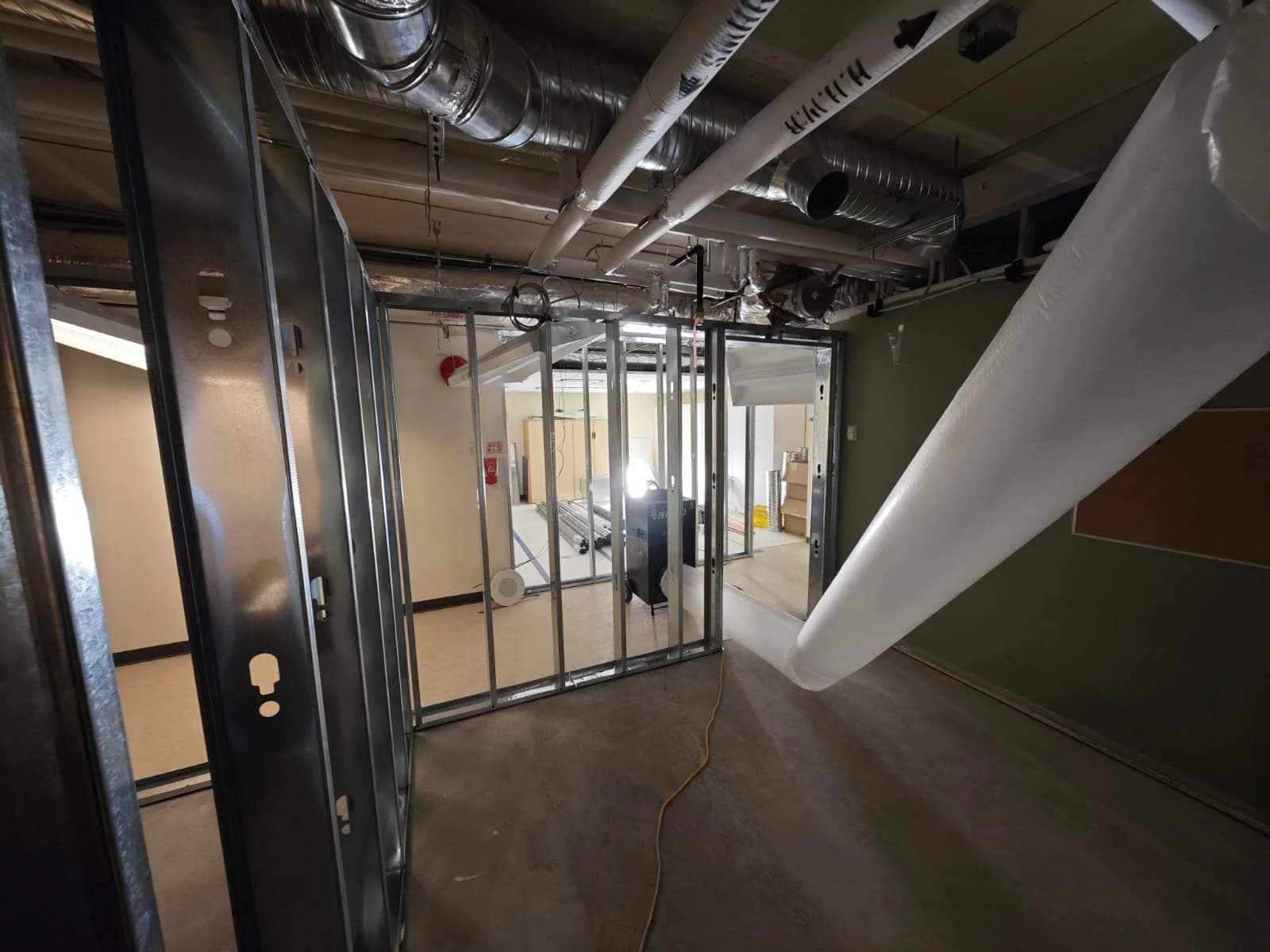 Interior partitions and overhead building services during a hospital expansion in the BC Interior