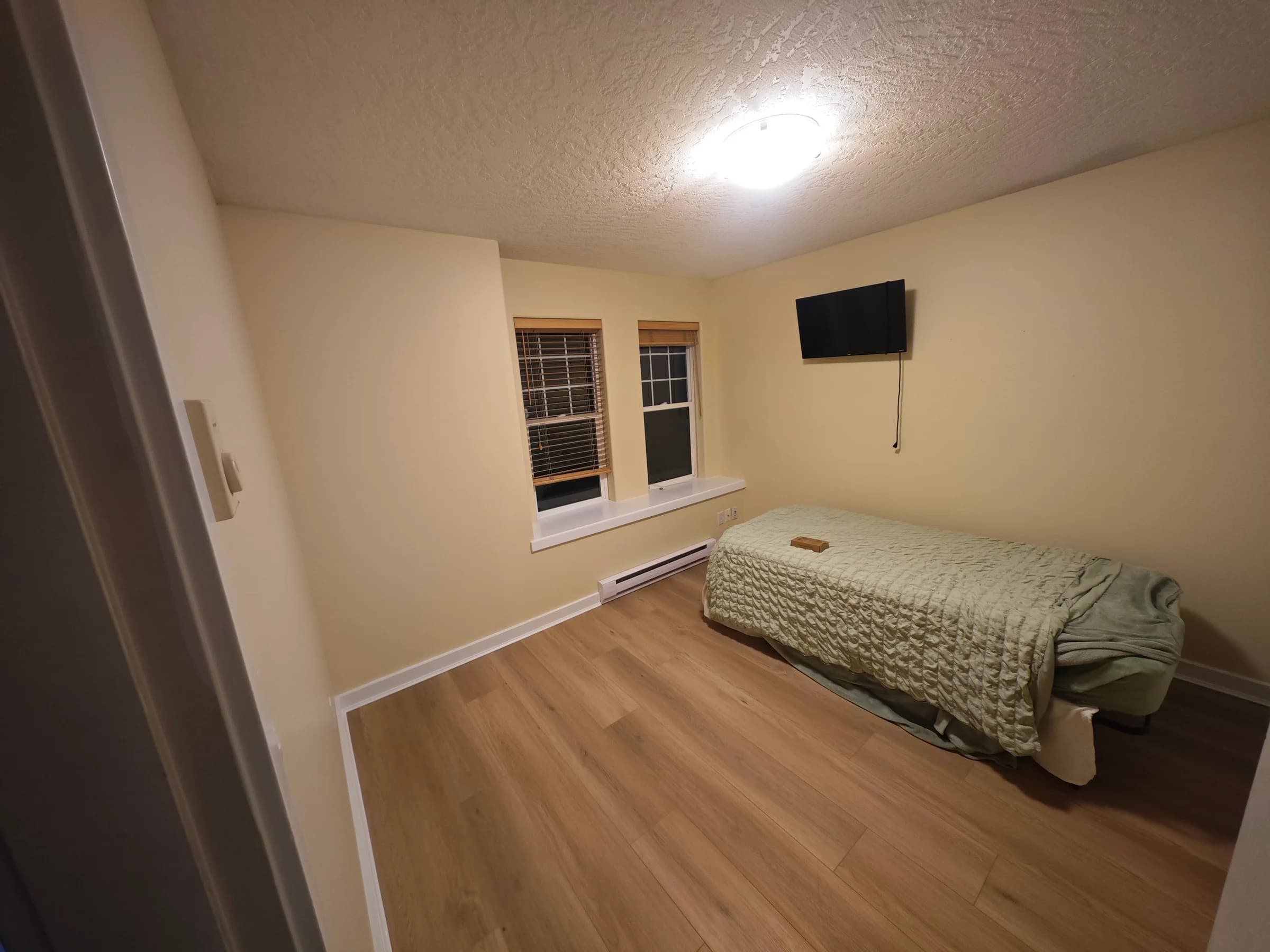 Bedroom interior after repainting — Corvus Contracting, Vancouver Island BC